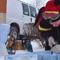 person chiseling ice
